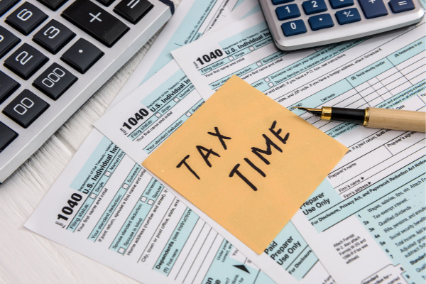 papers on a desk that say tax time