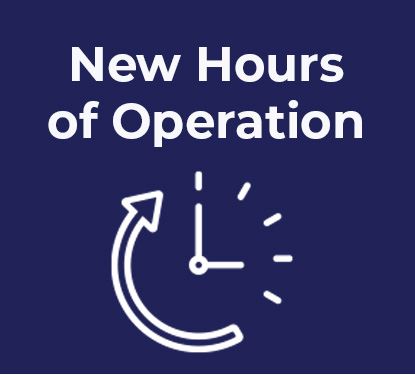 a white clock with new hours of operation over it